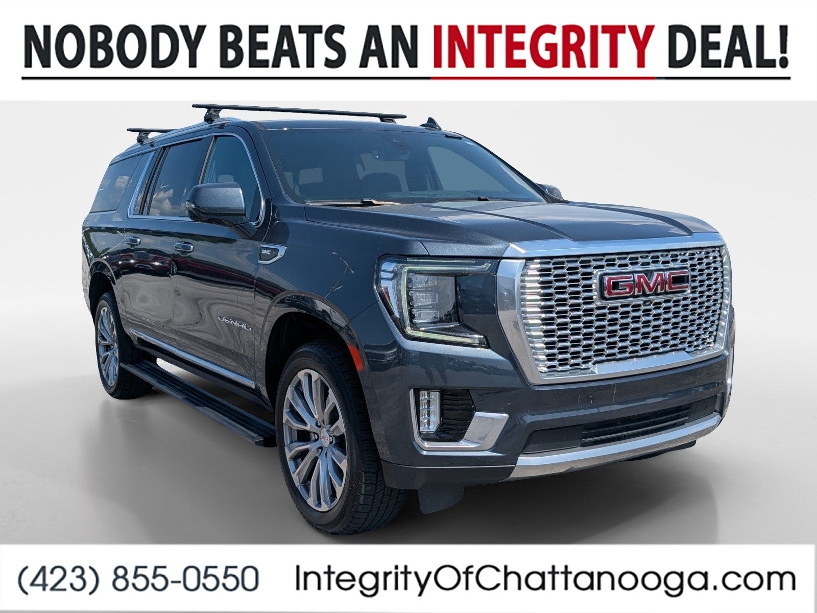 2021 GMC Yukon XL Denali in Dark Sky Metallic — front three-quarter view