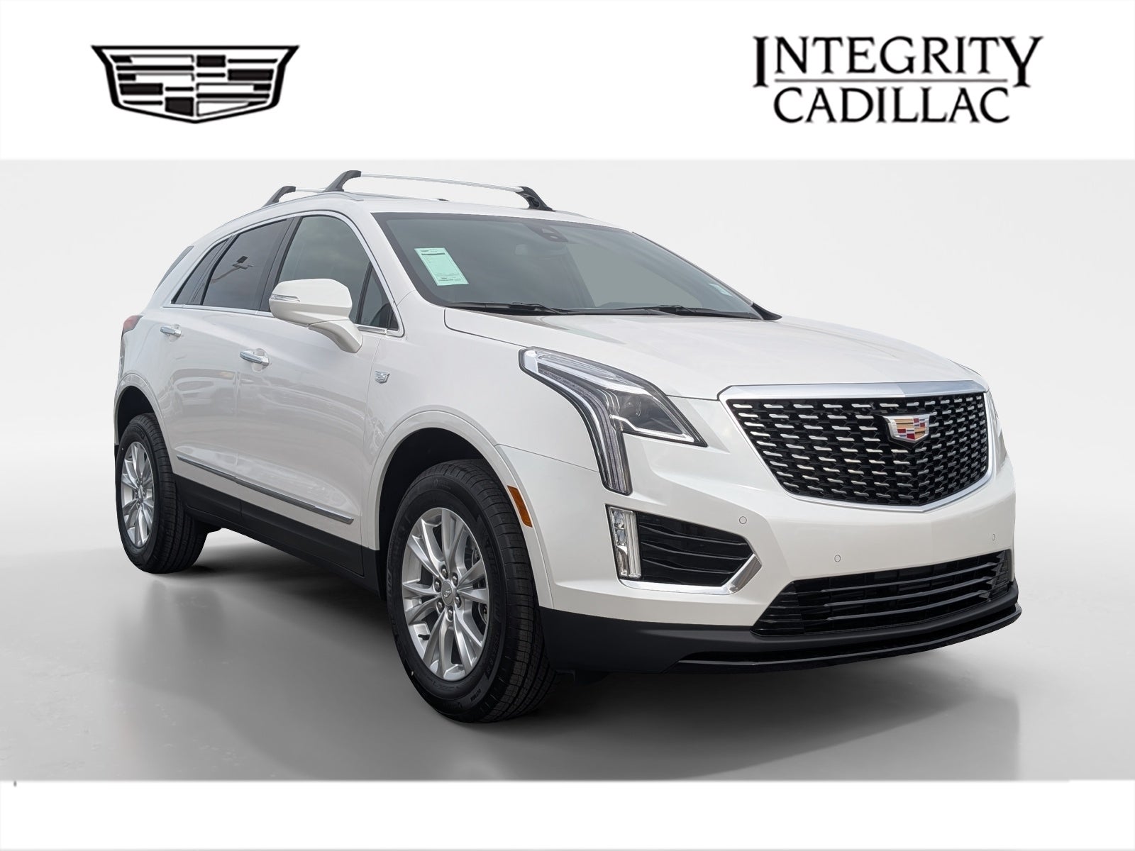 2026 Cadillac XT5 Luxury in Crystal White Tricoat — front three-quarter view