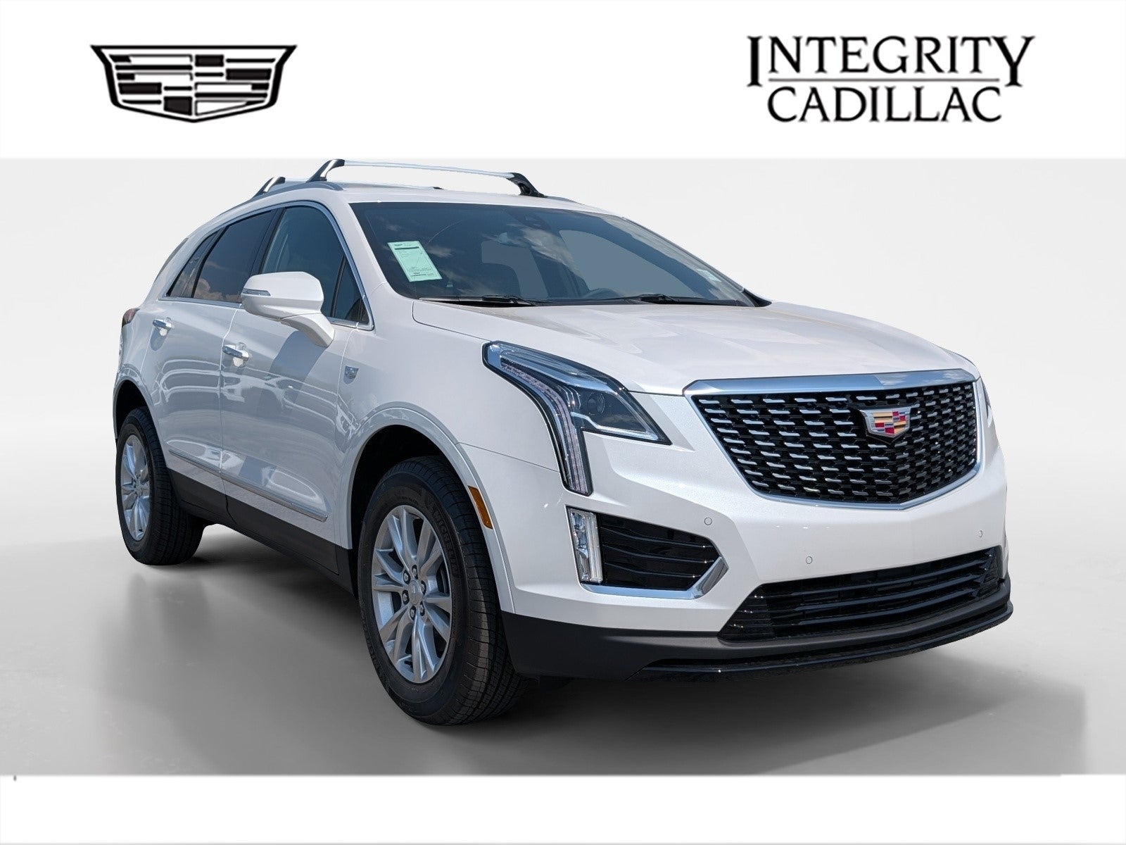2026 Cadillac XT5 Luxury in Crystal White Tricoat — front three-quarter view