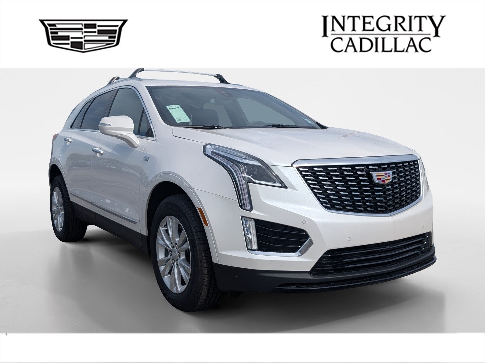 2026 Cadillac XT5 Luxury in Crystal White Tricoat — front three-quarter view